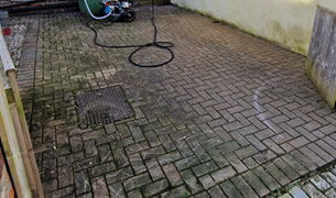 Pressure cleaning block paved yard - before